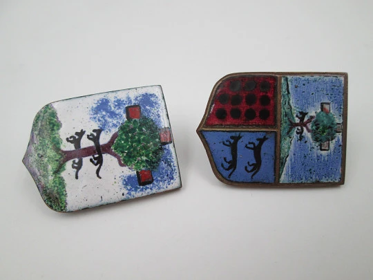 Two heraldic shields. Colored enamel and gold plated metal. Trees and greyhounds. Europe