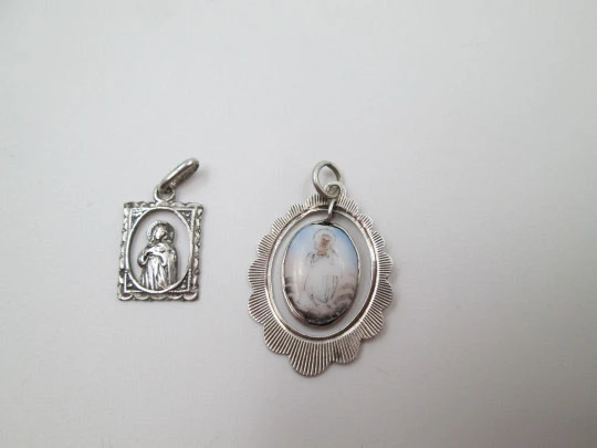 Two openwork religious medals. Sterling silver. Virgin Mary. Ring on top. Spain. 1950's