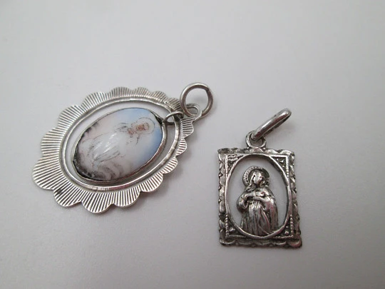 Two openwork religious medals. Sterling silver. Virgin Mary. Ring on top. Spain. 1950's