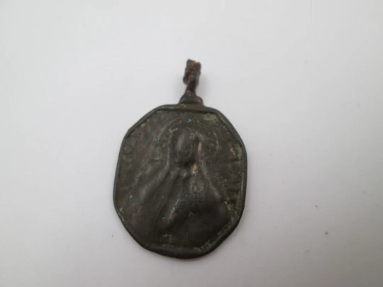 Virgin Mary and Saint Nicholas bronze medal. Octagonal shape. Ring on top. 18th century