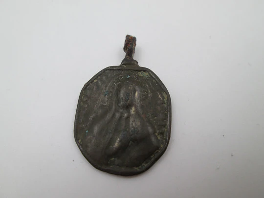 Virgin Mary and Saint Nicholas bronze medal. Octagonal shape. Ring on top. 18th century