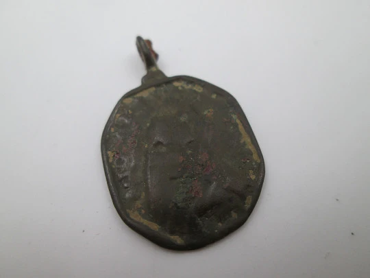 Virgin Mary and Saint Nicholas bronze medal. Octagonal shape. Ring on top. 18th century