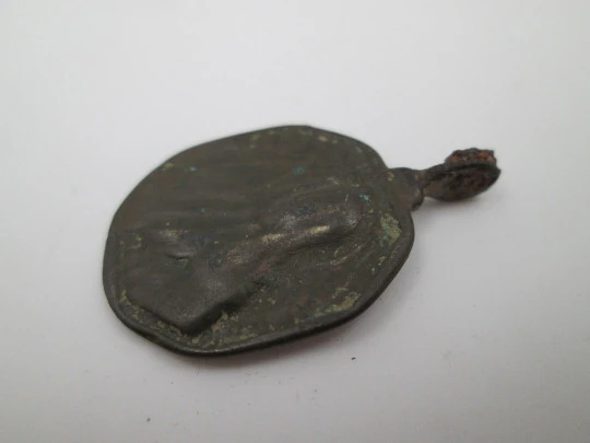 Virgin Mary and Saint Nicholas bronze medal. Octagonal shape. Ring on top. 18th century