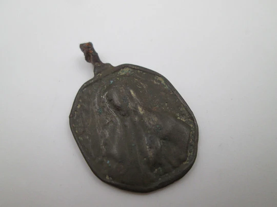 Virgin Mary and Saint Nicholas bronze medal. Octagonal shape. Ring on top. 18th century