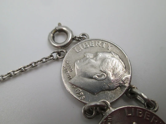 Women's articulated bracelet. Sterling silver. Dime and 1/4 dollar coins. Chain. 1960's