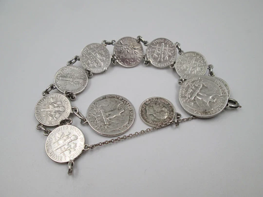 Women's articulated bracelet. Sterling silver. Dime and 1/4 dollar coins. Chain. 1960's