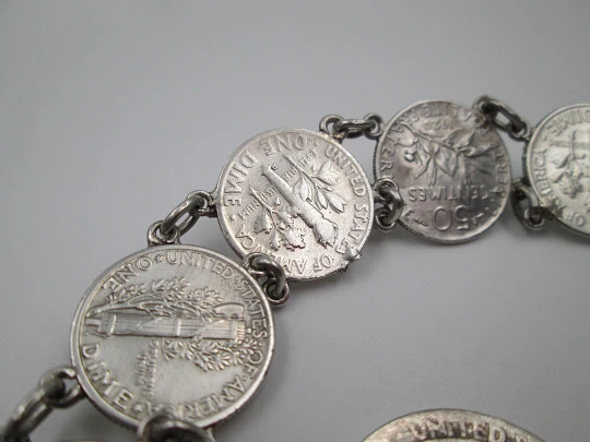 Women's articulated bracelet. Sterling silver. Dime and 1/4 dollar coins. Chain. 1960's