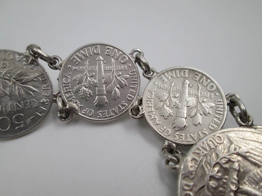 Women's articulated bracelet. Sterling silver. Dime and 1/4 dollar coins. Chain. 1960's