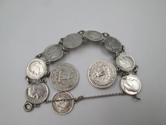 Women's articulated bracelet. Sterling silver. Dime and 1/4 dollar coins. Chain. 1960's