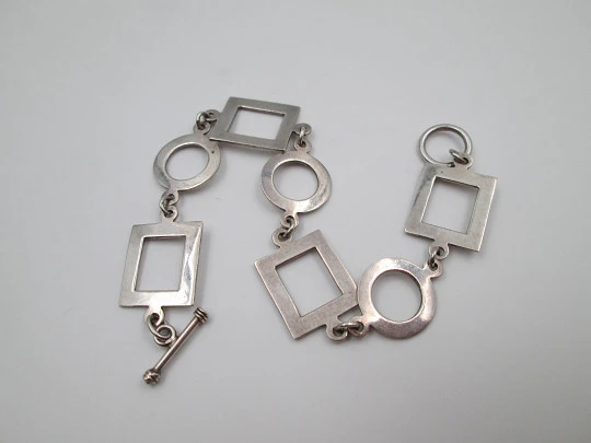 Women's bracelet. 925 sterling silver. Circle and square motifs. Ring and T bar clasp. 1980's