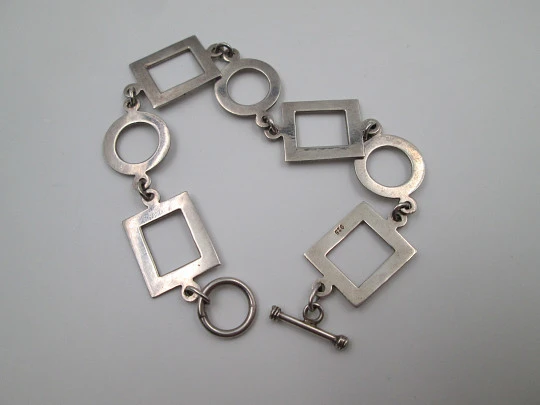 Women's bracelet. 925 sterling silver. Circle and square motifs. Ring and T bar clasp. 1980's