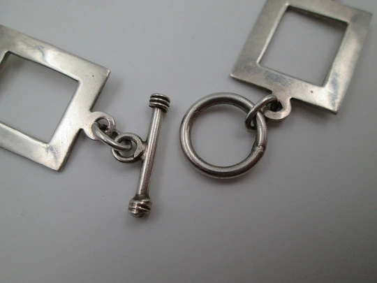 Women's bracelet. 925 sterling silver. Circle and square motifs. Ring and T bar clasp. 1980's