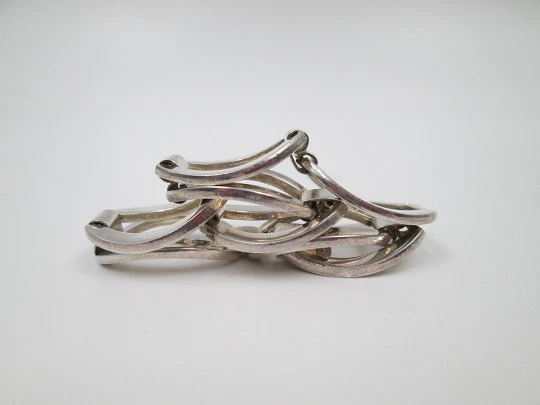 Women's bracelet. Interlocking ovals design. Sterling silver. Tab clasp. Europe. 1970's