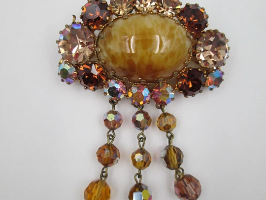 Women's brooch. Gold plated metal and bitone gems. Oval cabochon stone. USA. 1960's