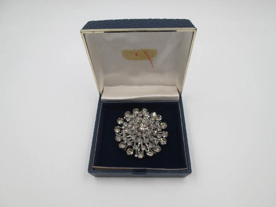 Women's brooch. Silver plated metal. White faceted gems. United States. 1970's