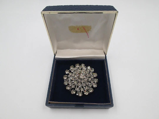 Women's brooch. Silver plated metal. White faceted gems. United States. 1970's