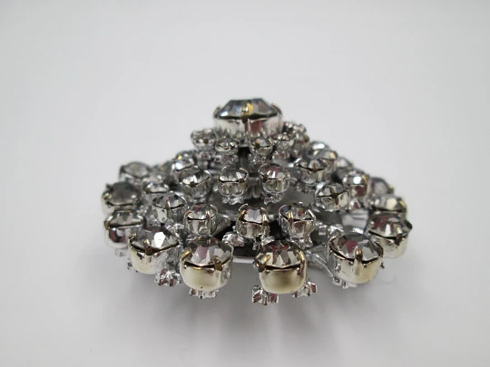 Women's brooch. Silver plated metal. White faceted gems. United States. 1970's