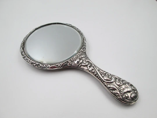 Women's ornate hand mirror. Embossed sterling silver. Vegetable motifs. Spain. 1960's