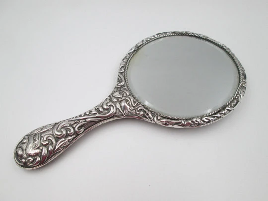 Women's ornate hand mirror. Embossed sterling silver. Vegetable motifs. Spain. 1960's