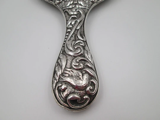 Women's ornate hand mirror. Embossed sterling silver. Vegetable motifs. Spain. 1960's