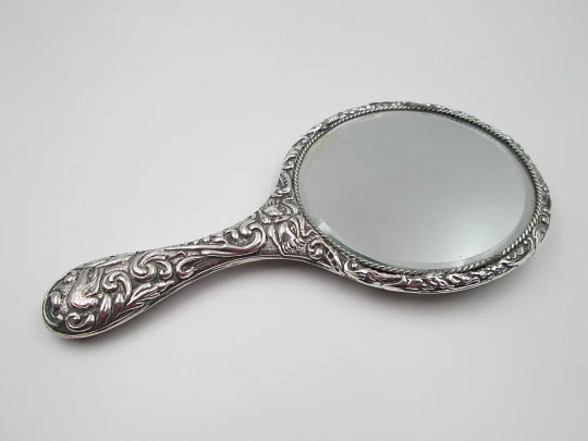 Women's ornate hand mirror. Embossed sterling silver. Vegetable motifs. Spain. 1960's