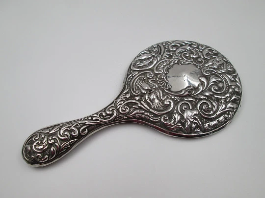 Women's ornate hand mirror. Embossed sterling silver. Vegetable motifs. Spain. 1960's