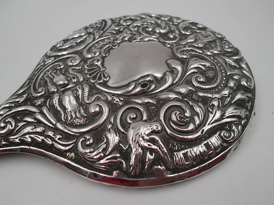 Women's ornate hand mirror. Embossed sterling silver. Vegetable motifs. Spain. 1960's