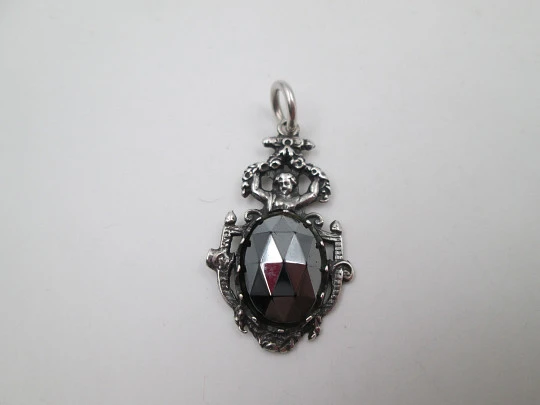 Women's sterling silver pendant. Cherub and faceted black gem. Ring on top. Europe. 1980's