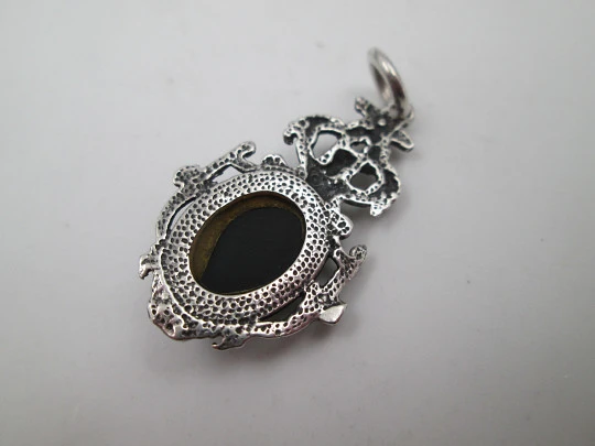 Women's sterling silver pendant. Cherub and faceted black gem. Ring on top. Europe. 1980's