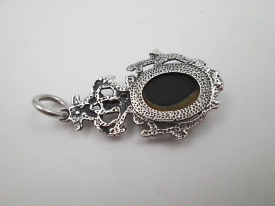 Women's sterling silver pendant. Cherub and faceted black gem. Ring on top. Europe. 1980's