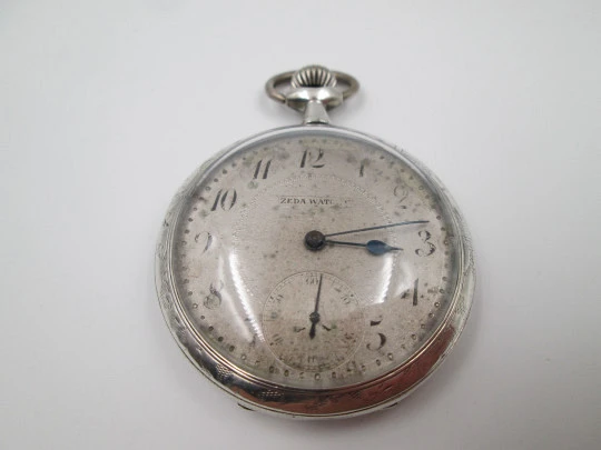 Zeda open-faced pocket watch. Stem-wind. 800 sterling silver. Floral motifs. Swiss. 1920's