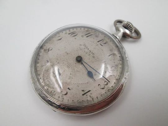 Zeda open-faced pocket watch. Stem-wind. 800 sterling silver. Floral motifs. Swiss. 1920's