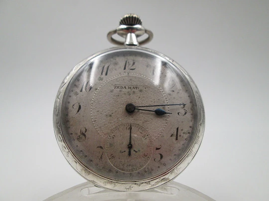 Zeda open-faced pocket watch. Stem-wind. 800 sterling silver. Floral motifs. Swiss. 1920's